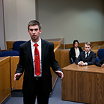 Students hold a mock trial.